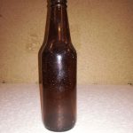 Sugar glass beer bottle 0038-Heineken / Lindenboom. Color is brown. Dimensions 20.5 x 5.5 cm.