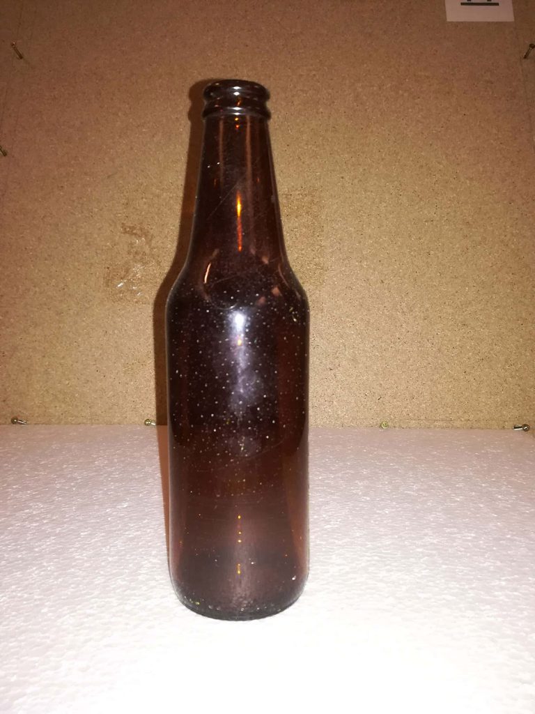 Sugar glass beer bottle 0038-Heineken / Lindenboom. Color is brown. Dimensions 20.5 x 5.5 cm.