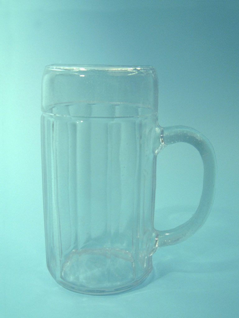 Sugar glass beer mug. 1 L serrated motif HxW 20.7 cm x 11 cm.