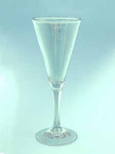 Champagne glass made of sugar glass. Long stem-conical, HxW 19.5 x 7.5 cm.