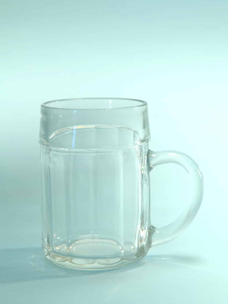 Beer mug 0.5 liter content. Cartel motif. H * W is: 13.5 x 9.3 cm